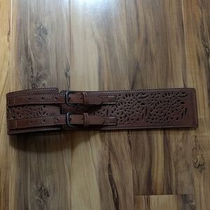 Wide faux leather and elastic belt with cutouts